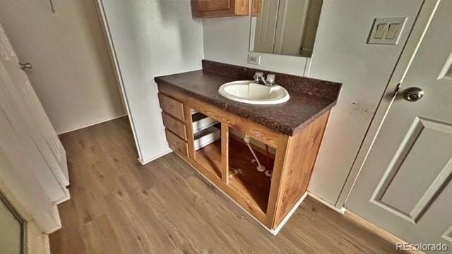 1212 Reed Lane La Junta, CO 81050 - Photo 16 of 23 a bathroom with sink and mirror