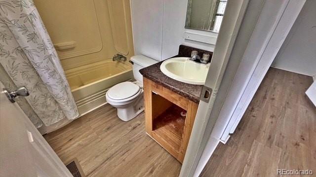 1212 Reed Lane La Junta, CO 81050 - Photo 18 of 23 a bathroom with a granite countertop toilet a sink and a bathtub