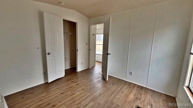 1212 Reed Lane La Junta, CO 81050 - Photo 22 of 23 an empty room with wooden floor and closet