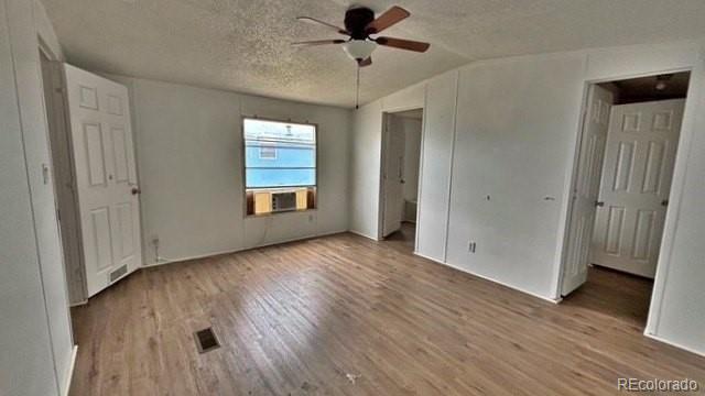 1212 Reed Lane La Junta, CO 81050 - Photo 8 of 23 wooden floor in an empty room with a window