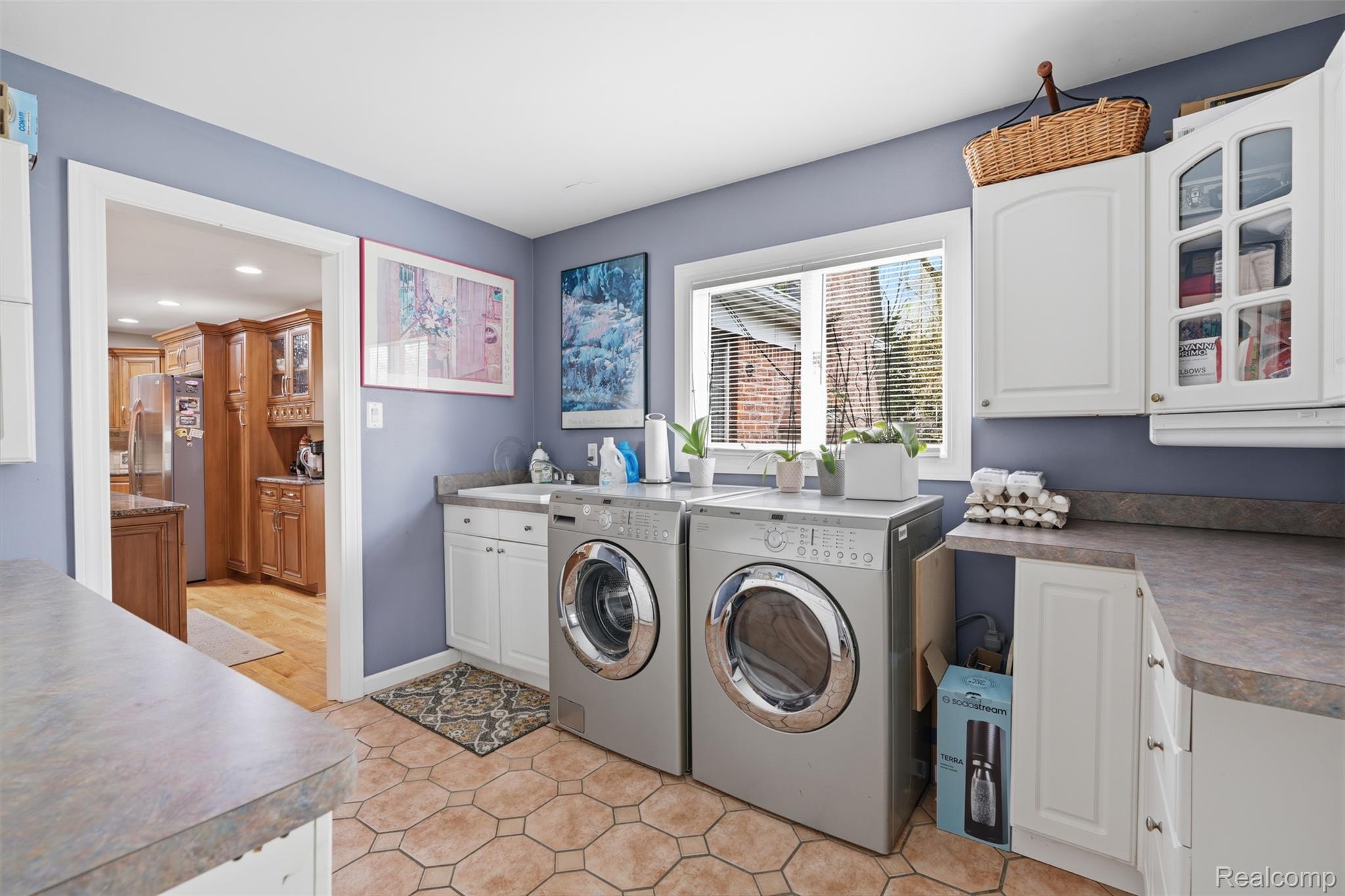 2210 Lancaster Road Bloomfield Hills, MI 48302 - Photo 26 of 35 Laundry room featuring cabinet space and independent washer and dryer
