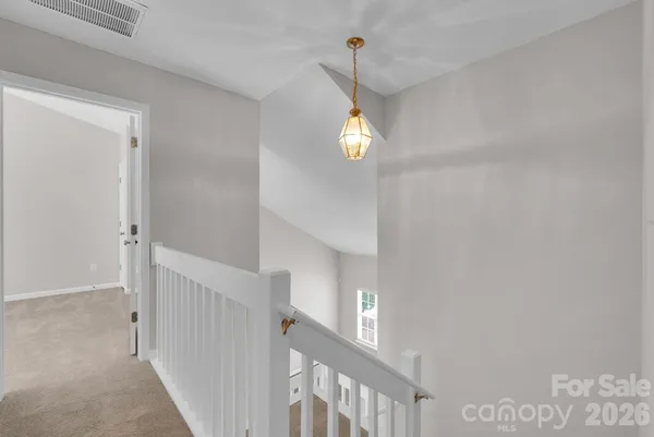 a view of a hallway view with a wooden floor