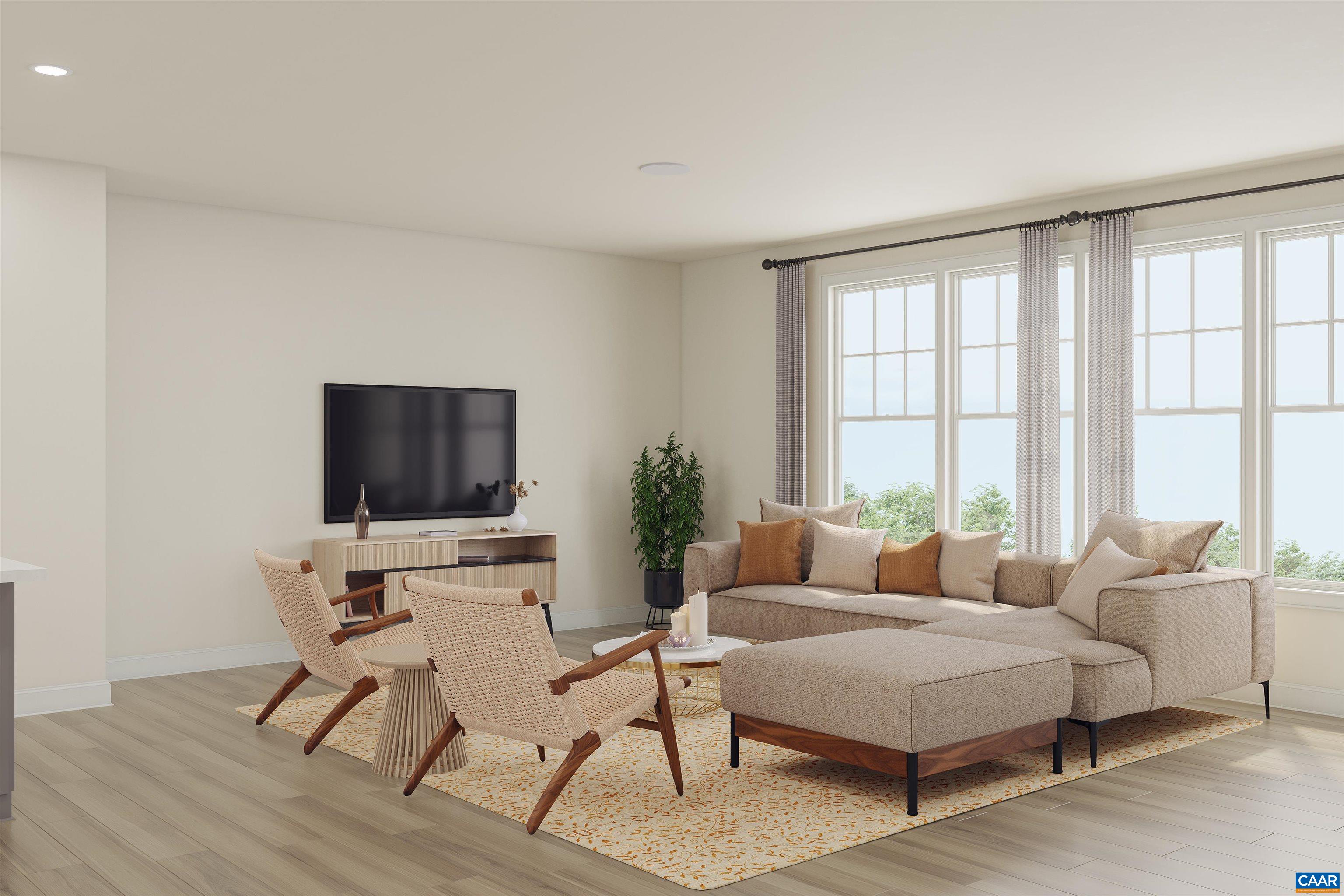 4 A Ryan Way Charlottesville, VA 22911 - Photo 5 of 16 a living room with furniture a flat screen tv and a large window
