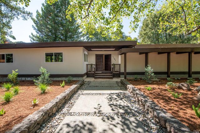 a house view with a backyard space