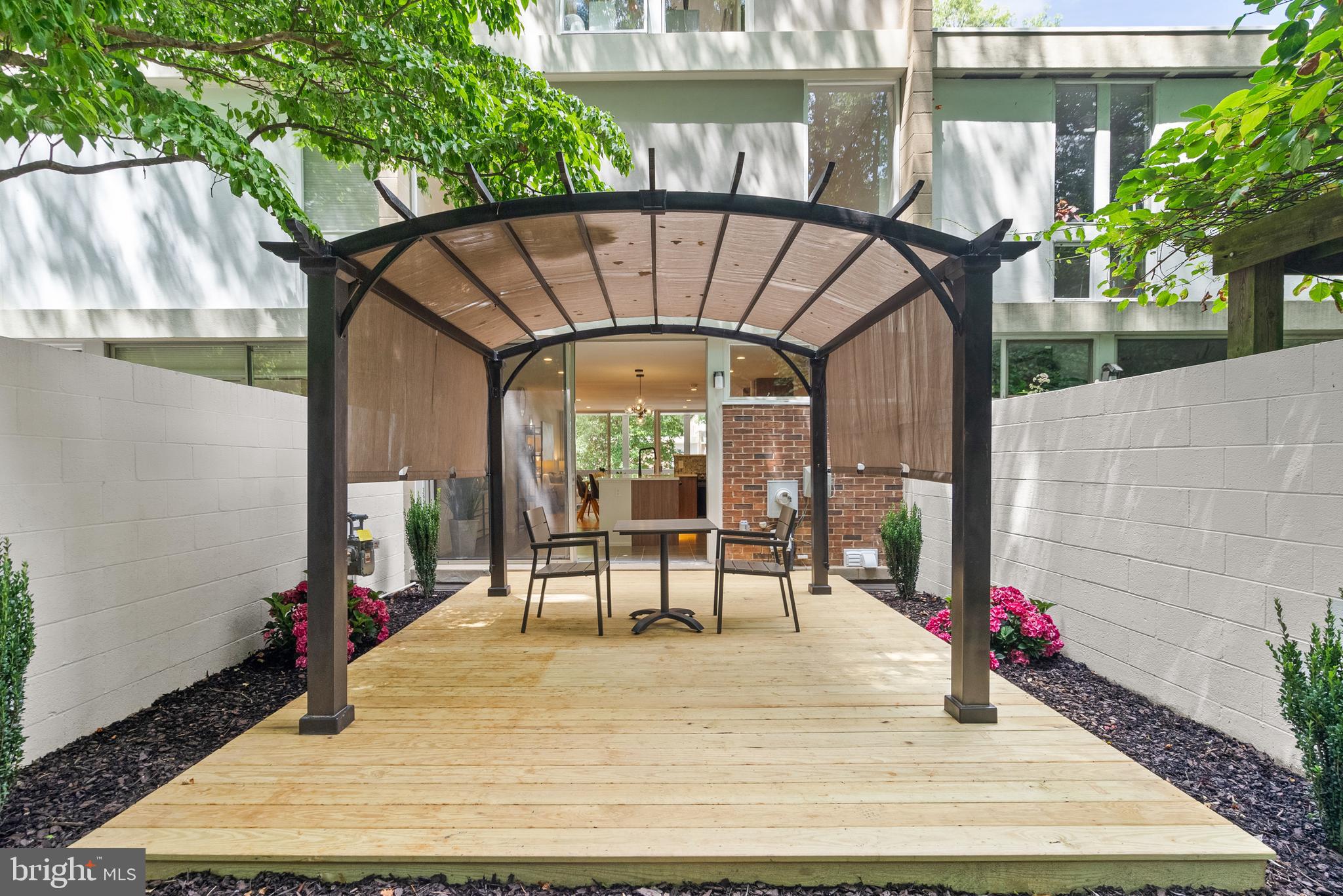 11519 Hickory Cluster Reston, VA 20190 - Photo 11 of 28 a view of outdoor space yard deck patio and outdoor kitchen