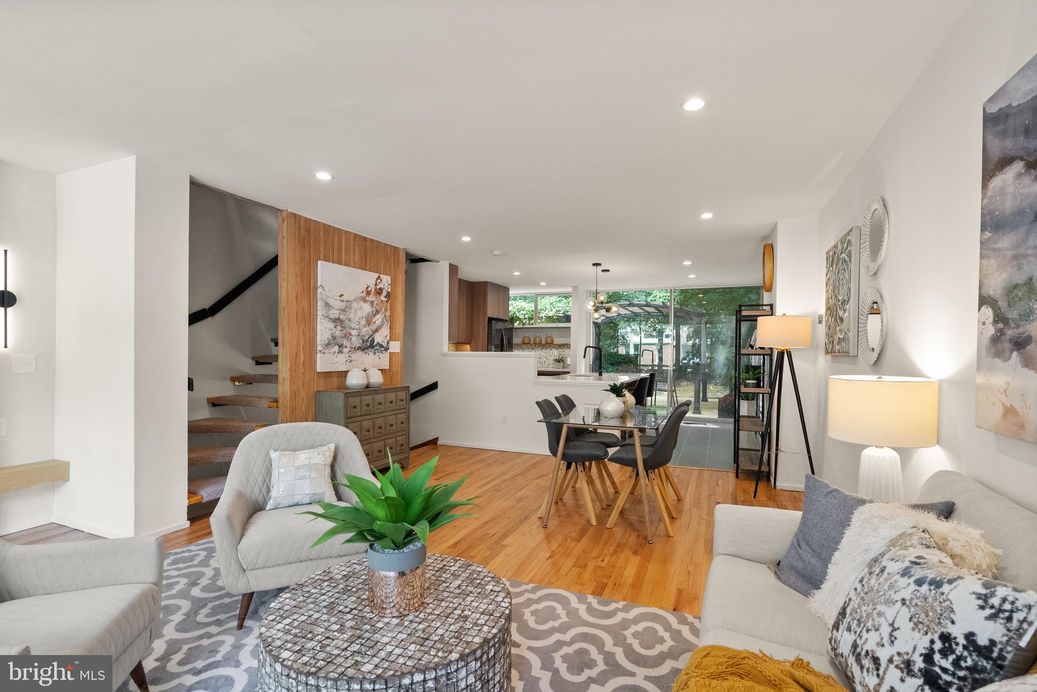 11519 Hickory Cluster Reston, VA 20190 - Photo 7 of 28 a living room with furniture potted plant wooden floor and a large window