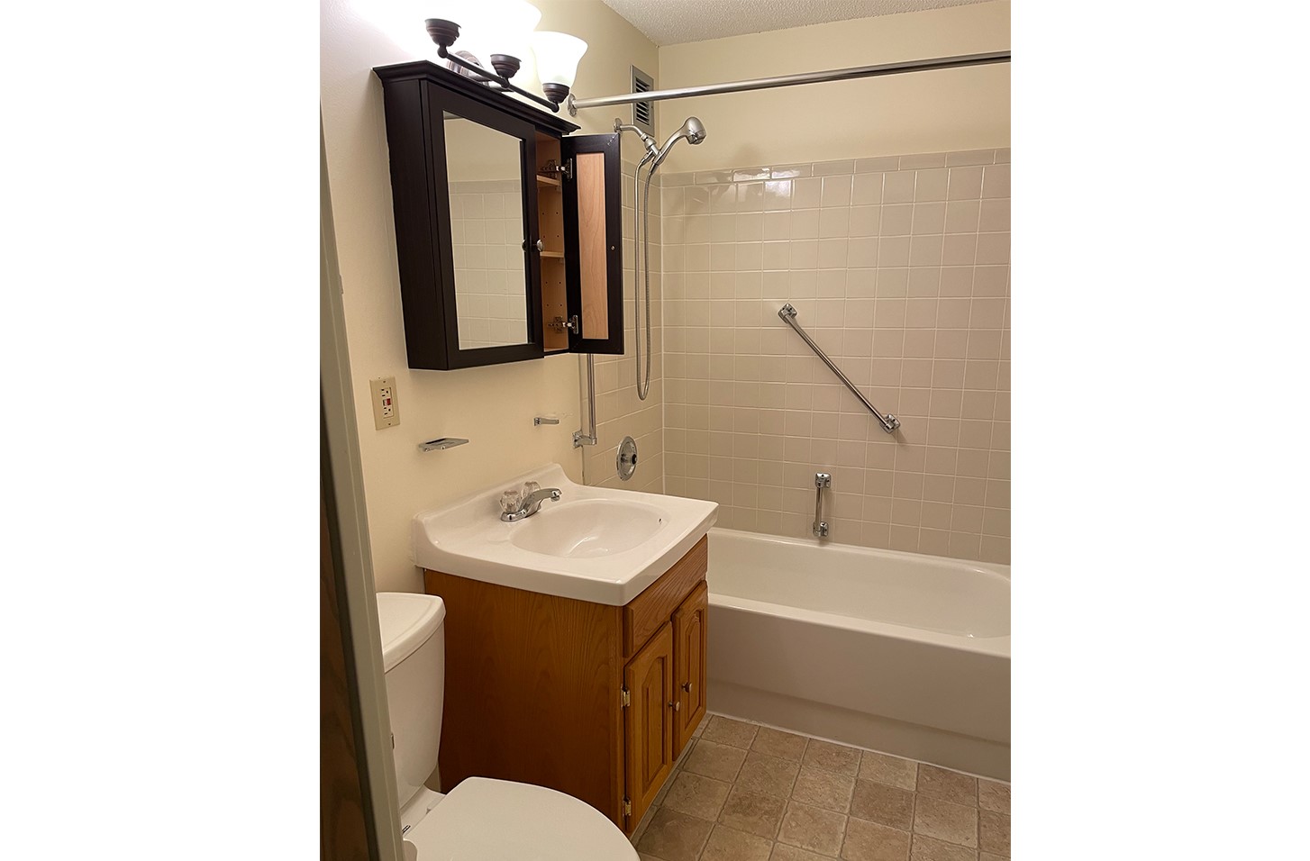 5 Green Street, Unit 100 Dover, NH 03820 - Photo 10 of 10 a bathroom with a sink toilet and shower