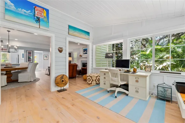 a view of a workspace with furniture and a kitchen