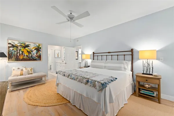 a bedroom with a bed and dresser