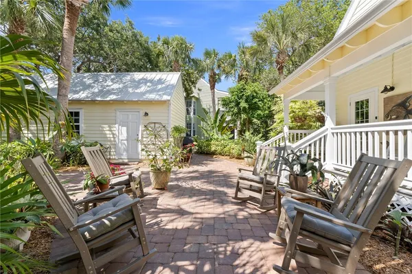 a view of a patio with two chairs and a table