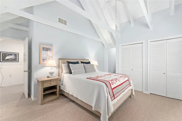 a bedroom with bed and a window