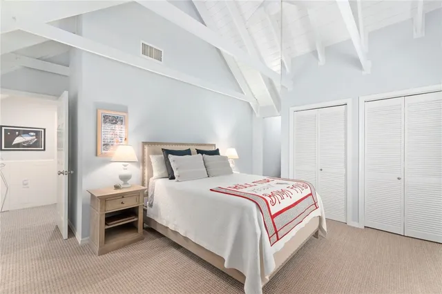 a bedroom with bed and a window