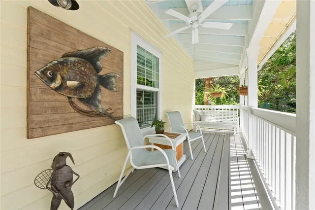 a view of a dining room with furniture wooden floor and windows