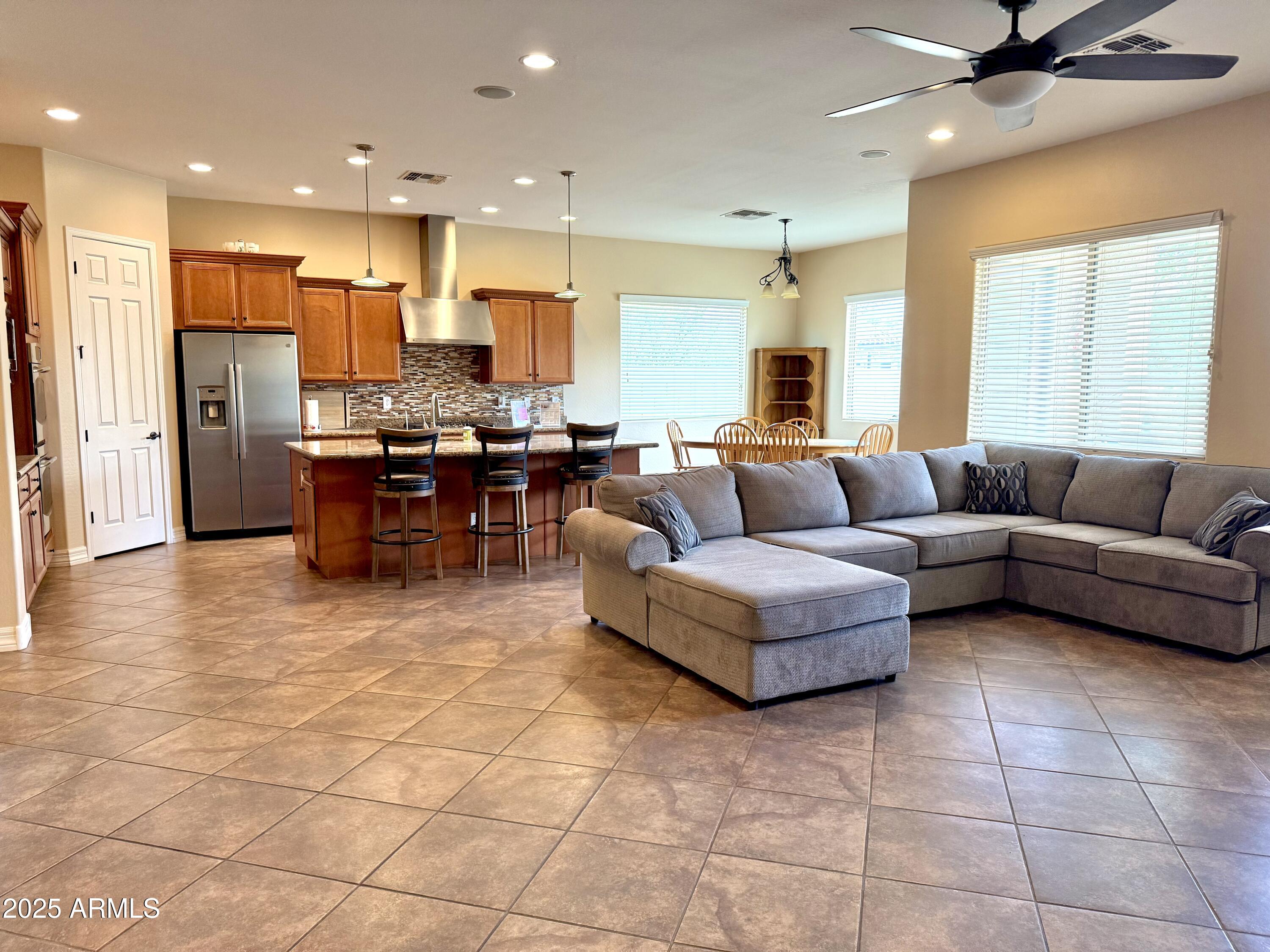 16205 West Berkeley Road Goodyear, AZ 85395 - Photo 11 of 32 Hall to LR and kitchen