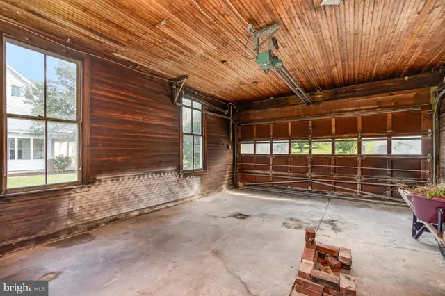 a view of room with wooden floor