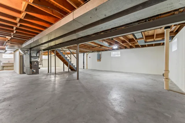 an aerial view of a house with yard and green space
