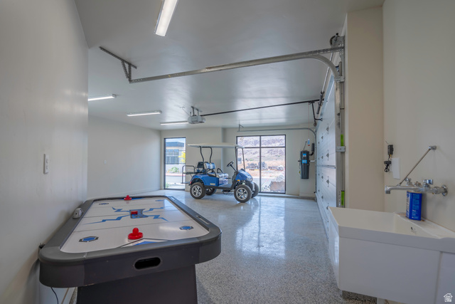 3606 South Cypress Road Hurricane, UT 84737 - Photo 45 of 69 Game room with speckle patterned floor and a garage