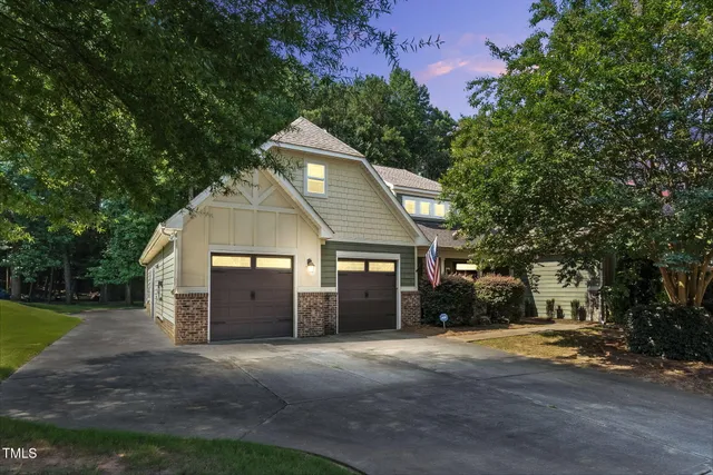 a view of a house with a yard and garage