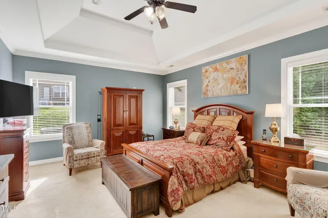 a bedroom with a bed and glass door