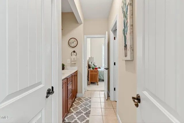 a bathroom with a granite countertop shower and a sink