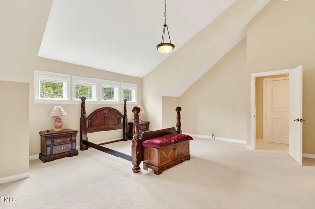 a living room with furniture a flat screen tv and a large window