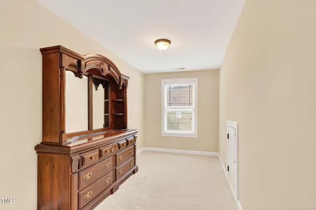 a view of dresser and mirror