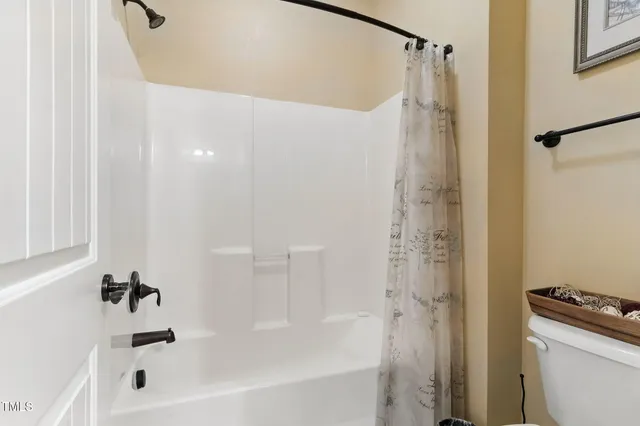 a bathroom with a tub a sink and a shower