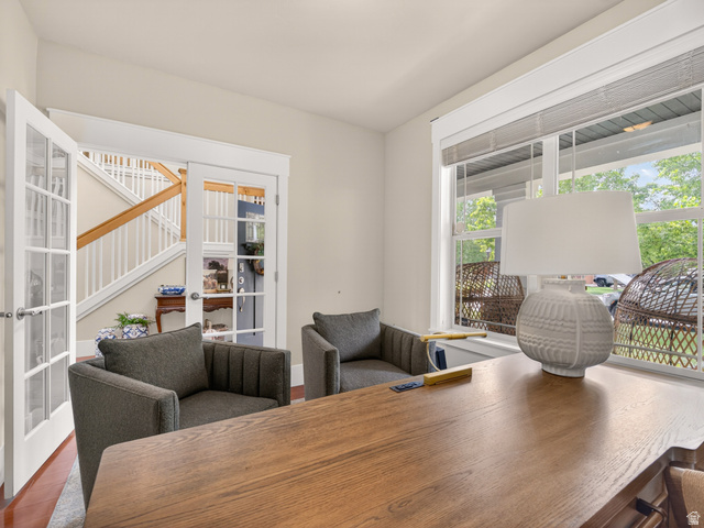 557 Craftsman Way Midway, UT 84049 - Photo 7 of 59 Room featuring French doors, wood-finish flooring, and a large window with horizontal blinds