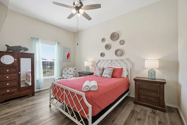 a bedroom with a bed and a dresser