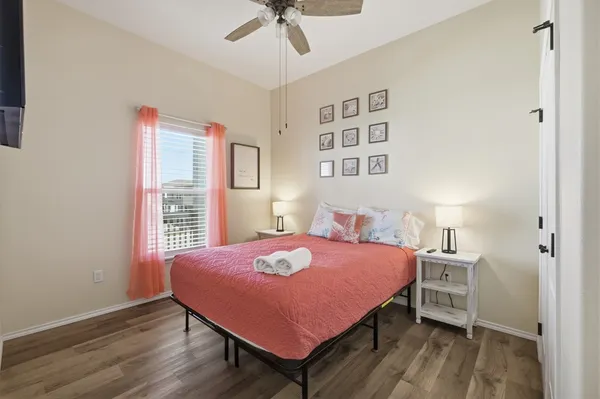 a bedroom with a bed and a table in it