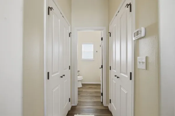 a view of a bathroom with wooden floor