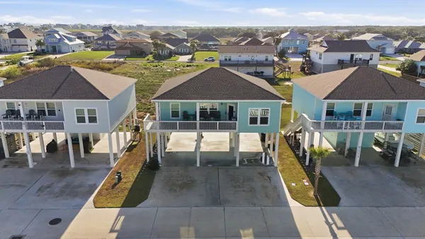 an aerial view of a house with a swimming pool