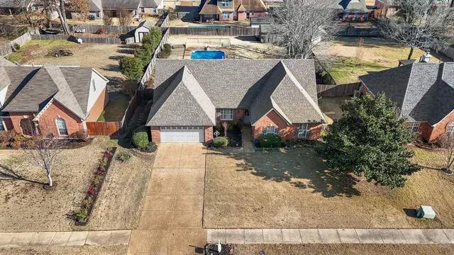 an aerial view of a house with swimming pool
