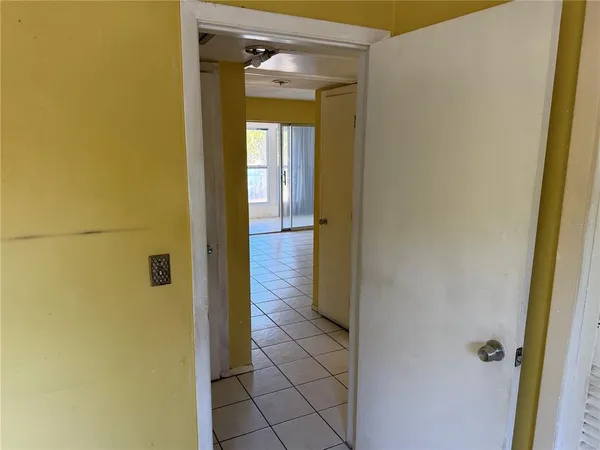 a view of a bathroom from a hallway