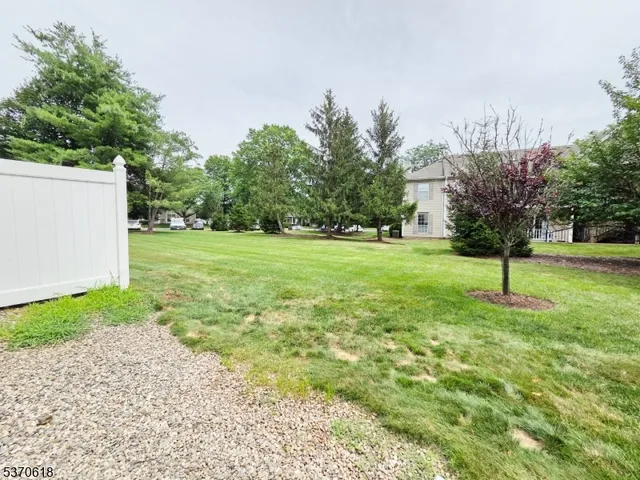 a backyard of a house and trees