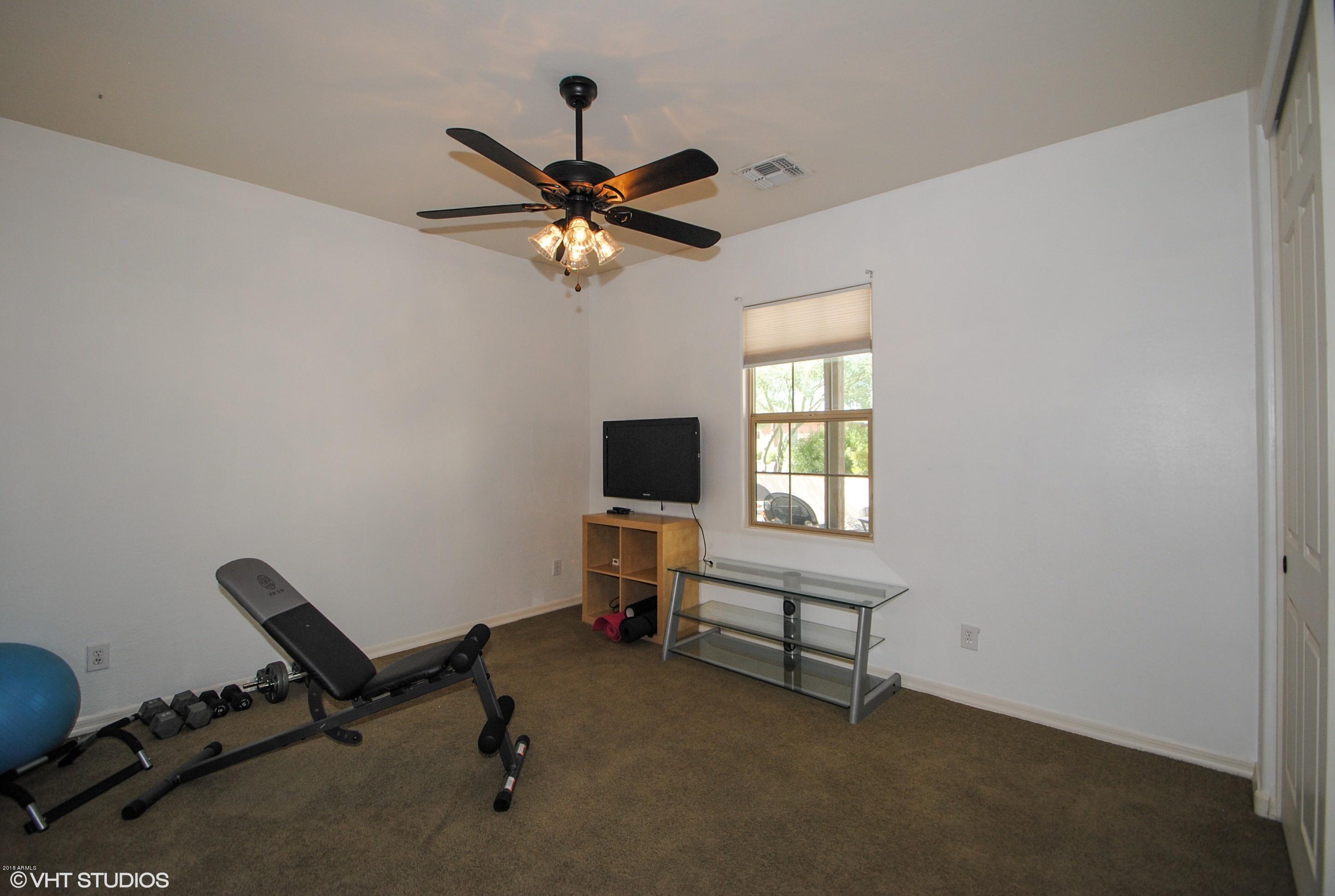 16238 West Granada Road Goodyear, AZ 85395 - Photo 16 of 25 15_16238WGranada_18001_Bedroom_HiRes