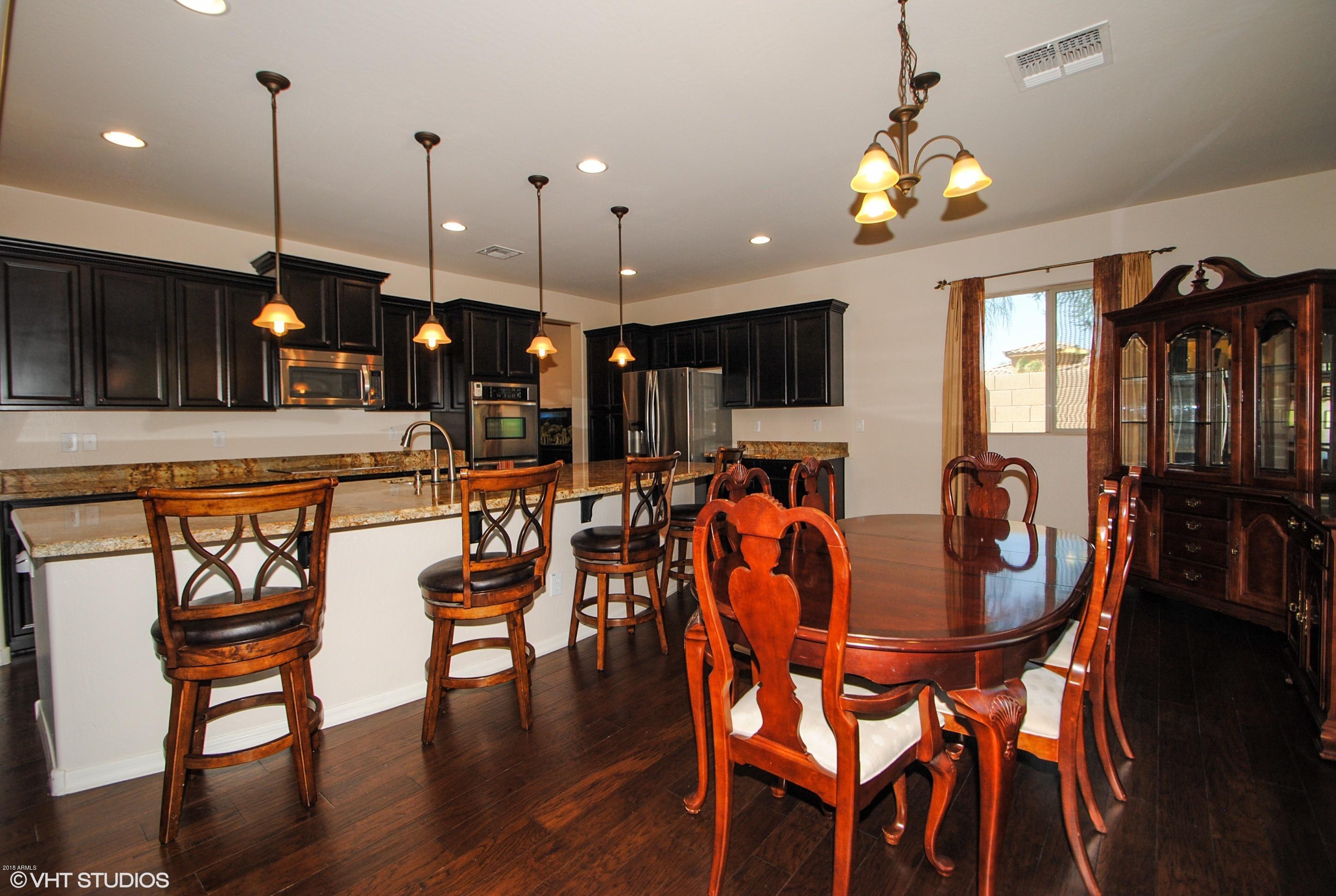16238 West Granada Road Goodyear, AZ 85395 - Photo 10 of 25 09_16238WGranada_92_KitchenDiningRoom_Hi