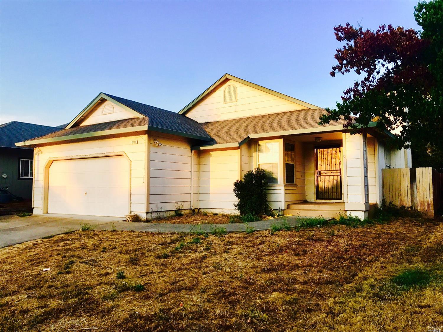 2708 Bond Street Santa Rosa, CA 95407 - Photo 1 of 1 a front view of a house with a yard