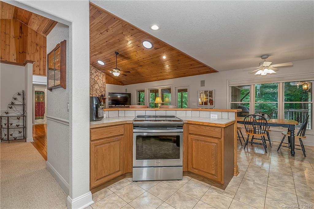 215 Beechtree Circle Rutherfordton, NC 28139 - Photo 13 of 42 a kitchen with stainless steel appliances granite countertop a stove and more cabinets