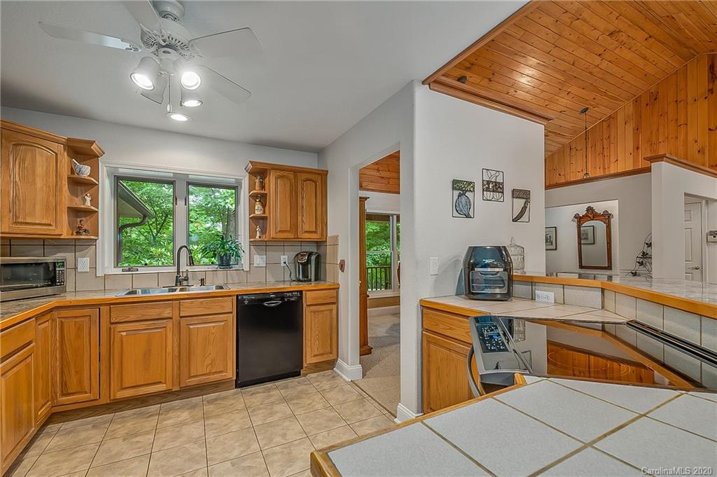 215 Beechtree Circle Rutherfordton, NC 28139 - Photo 15 of 42 a kitchen with stainless steel appliances granite countertop a sink and cabinets
