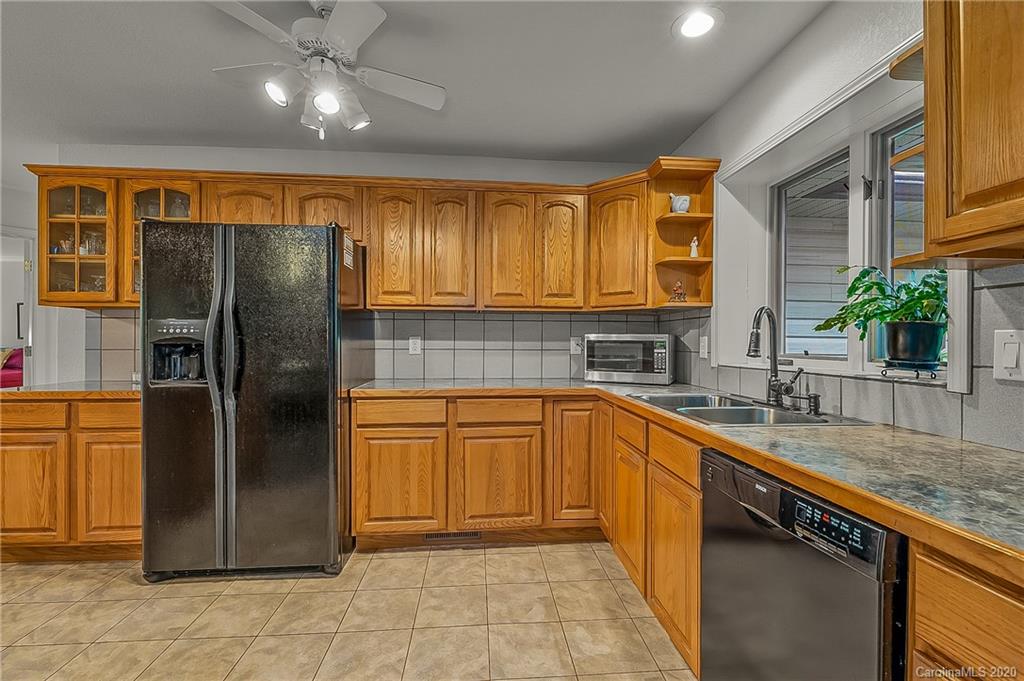 215 Beechtree Circle Rutherfordton, NC 28139 - Photo 16 of 42 a kitchen with stainless steel appliances granite countertop a refrigerator and a sink