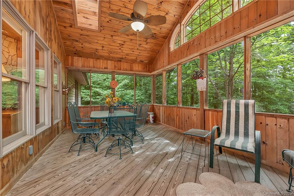 215 Beechtree Circle Rutherfordton, NC 28139 - Photo 18 of 42 a view of balcony with chairs and wooden floor
