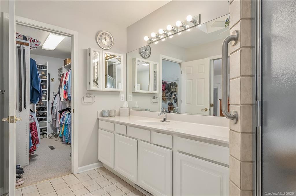 215 Beechtree Circle Rutherfordton, NC 28139 - Photo 22 of 42 a bathroom with a sink vanity and a mirror