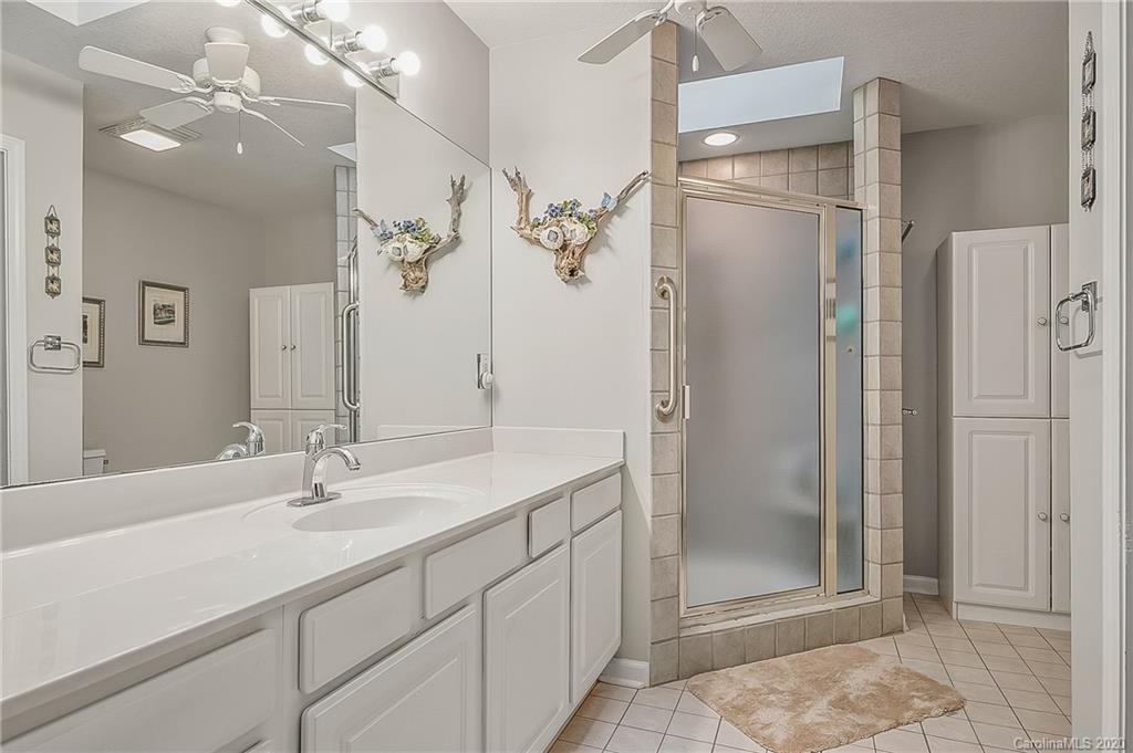 215 Beechtree Circle Rutherfordton, NC 28139 - Photo 25 of 42 a bathroom with a shower sink and mirror