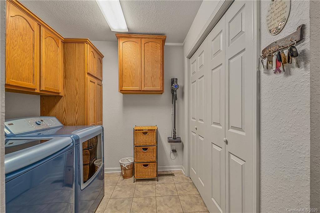 215 Beechtree Circle Rutherfordton, NC 28139 - Photo 29 of 42 a room with a stove top oven a sink and cabinets