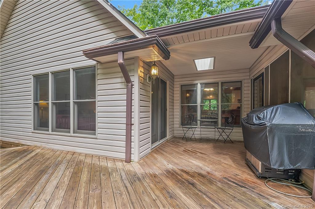 215 Beechtree Circle Rutherfordton, NC 28139 - Photo 30 of 42 a view of a house with a barbeque and wooden floor