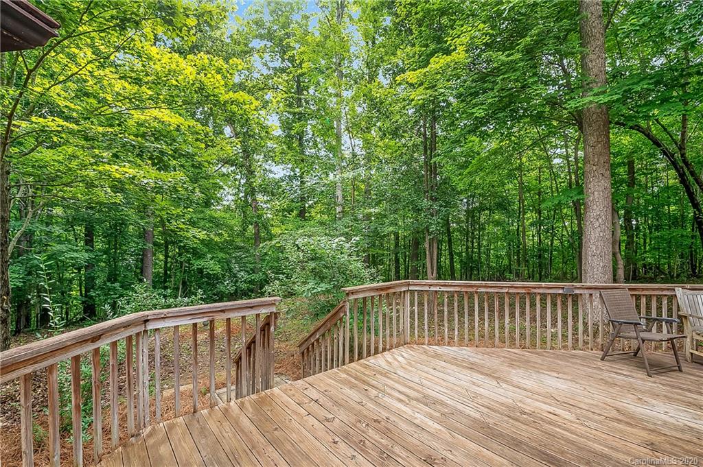 215 Beechtree Circle Rutherfordton, NC 28139 - Photo 38 of 42 a balcony with wooden floor and trees in the background