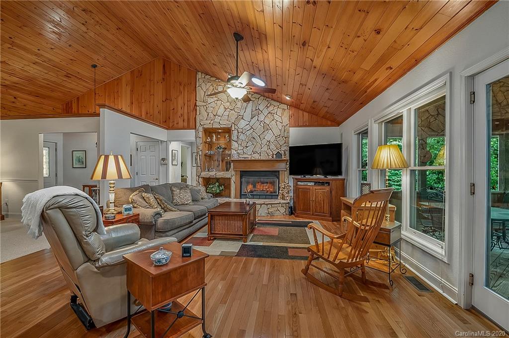 215 Beechtree Circle Rutherfordton, NC 28139 - Photo 10 of 42 a living room with fireplace furniture and a flat screen tv