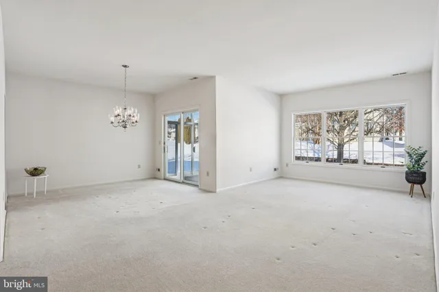 a view of house with backyard