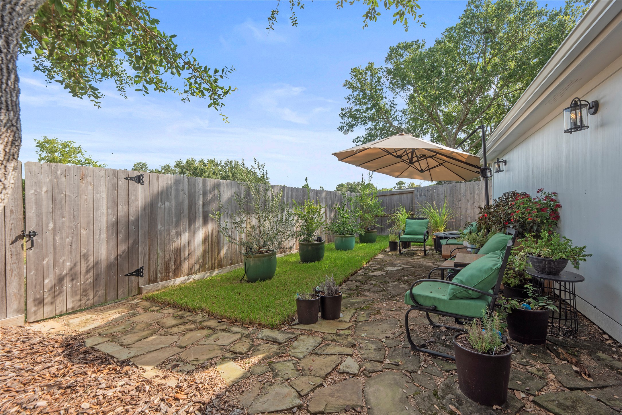 16222 Rainbow Lake Road Houston, TX 77095 - Photo 29 of 34 Back fence with a gate that leads to the walking path directly behind the home.